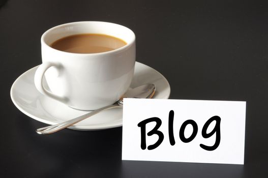 blog and cup of coffee with copyspace showing internet or rss concept