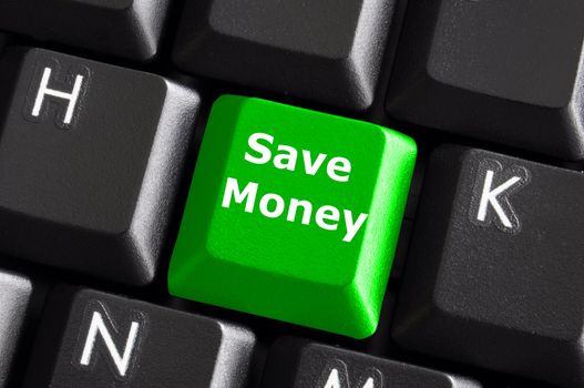save money for investment concept with a green button on computer keyboard