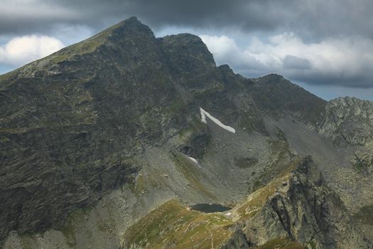 Caltun lake and importants peaks (Caltun and Lespezi) in Fagras Mountains,from Romania.