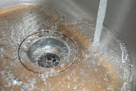 water flow into the drain in the kitchen
