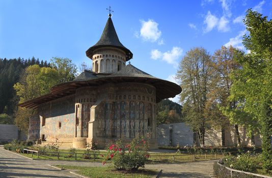 Image of Voronet Monastery,Moldavia,Romania.The frescoes at Voronet feature an intense shade of blue known in Romania as "Voronet blue".It was built in 1488 by Stephen the Great and is one of the most famous painted monasteries from Moldavia.