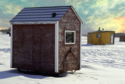 Temporary shacks used for ice fishing situated on the frozen "Red River" in Manitoba.