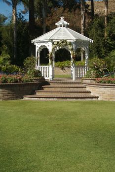 Elegant Wedding Gazebo with Steps and Lush Grass.