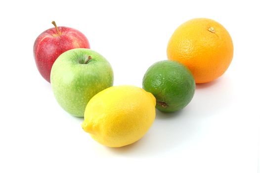 fruits like apple , lemon , citron orange and lime isolated on a white background