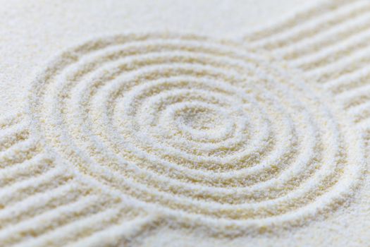 Abstract composition of fine white sand with circles