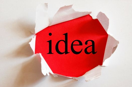 idea on red background in a paper hole