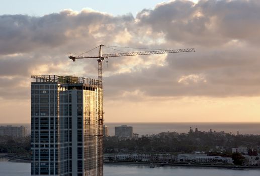 Silhouette of Crane and Building Construction Site