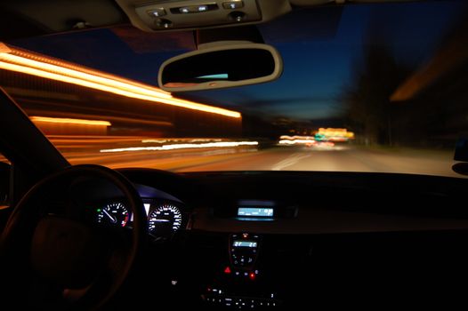 night drive with car in motion through the city shows the speed