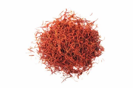 Handful of red saffron on a white background