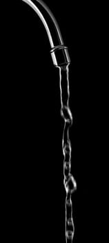 Tap with splashing water on black background