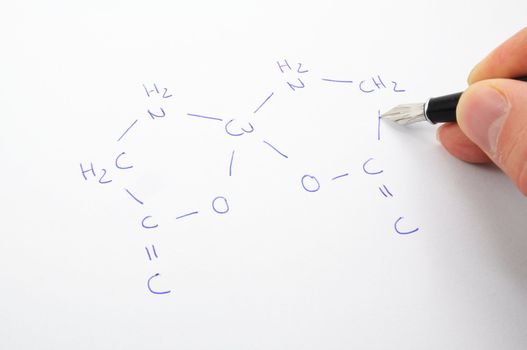 chemical formula with hand and pan ob sheet of paper