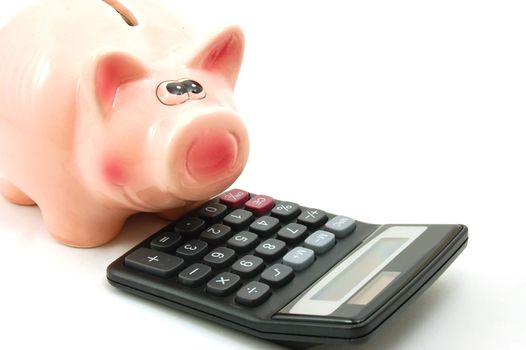saving money with a piggy bank isolated on white