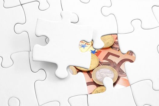 puzzle and money showing business or finance concept