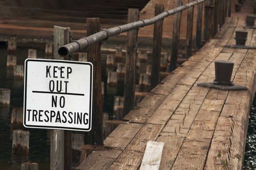 Keep Out, No Trespassing Sign and Abandoned Dock