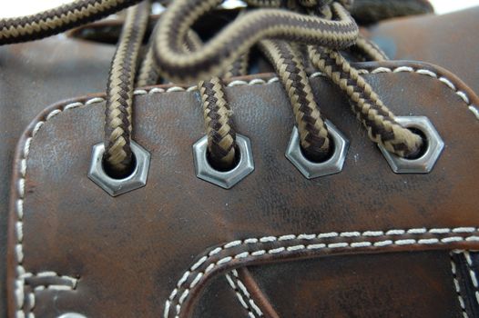macro of a brown leather shoe and bootlace