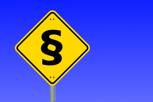 law concept with paragraph on a yellow traffic sign