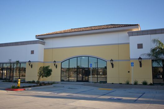 New Vacant Retail Building & Parking Spaces.