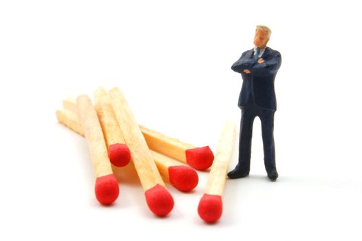 business man and matches isolated on white background