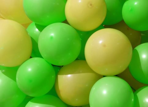 green and yellow party balloons close-up