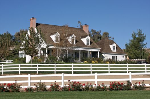 A newly constructed, modern american home with fresh landscaping.