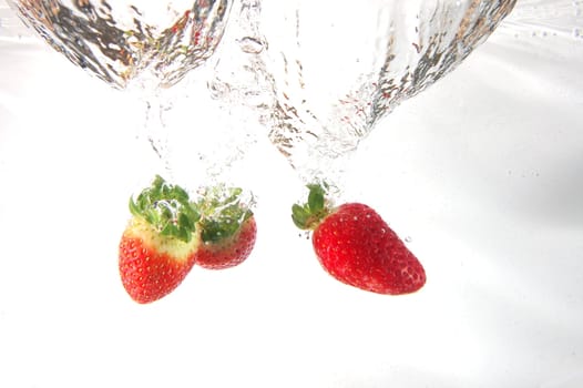 strawberry splash in water showing a fitness concept