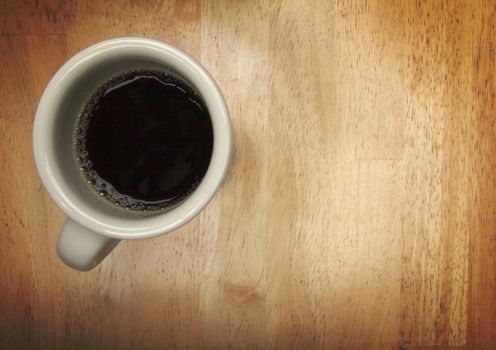 Coffee Cup Overhead on a Wood Background