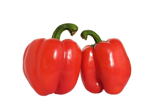 Two large, red peppers, isolated on a white background.