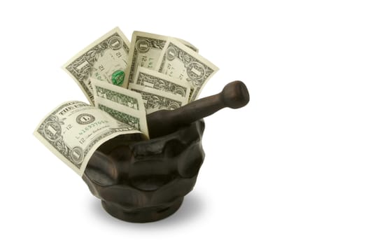 Grinding for Dollars - Wood mortar and pestle containing dollar bills on a white background.