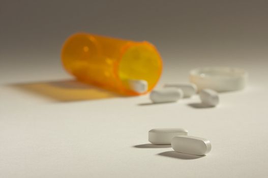 Pills and Fallen Bottle with Dramatic Lighting.