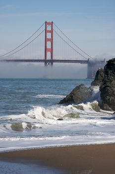 The Golden Gate Bridge in the early morning fog. San Francisco, California, United States.