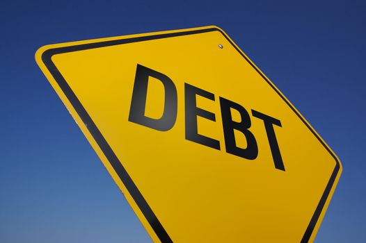 Debt Road Sign on a Deep Blue Sky Background.