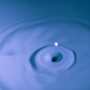 Abstract photos of milk droplets falling and captured on impact