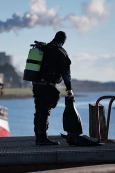 Diver with pollution in background