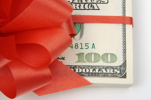 One Hundred Dollar Bills Wrapped in Red Ribbon.