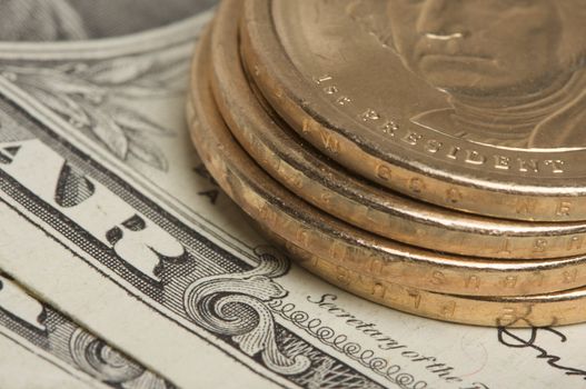 Abstract of the new U.S. Dollar coin on Dollar Bills with Narrow Depth of Field.