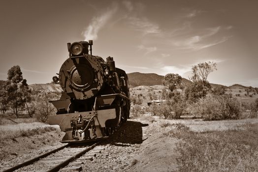 sepia brown image of an old steam train 