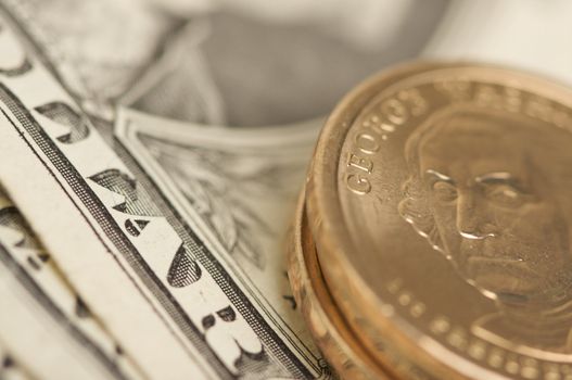 Abstract of the new U.S. Dollar coin on Dollar Bills with Narrow Depth of Field.