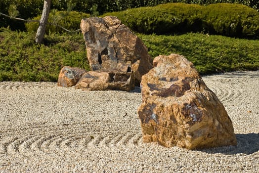 japanese rock garden showing raked gravel stones