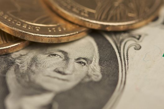 Abstract of the new U.S. Dollar coin on Dollar Bills with Narrow Depth of Field.