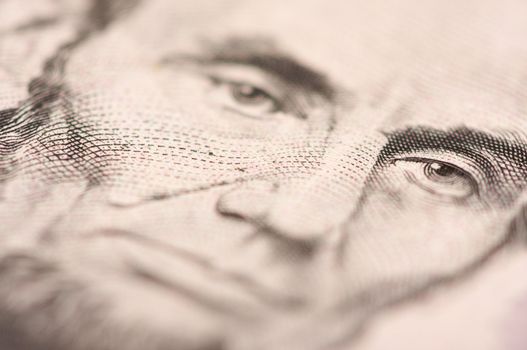 Abstract Macro of U.S. Five Dollar Bill's Abraham Lincoln face with Narrow Depth of Field.