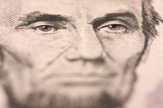 Abstract Macro of U.S. Five Dollar Bill's Abraham Lincoln face with Narrow Depth of Field.