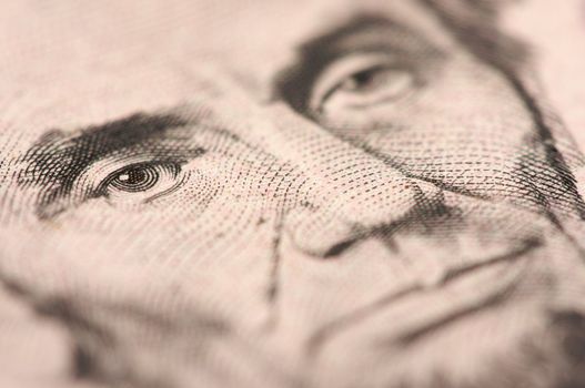 Abstract Macro of U.S. Five Dollar Bill's Abraham Lincoln face with Narrow Depth of Field.