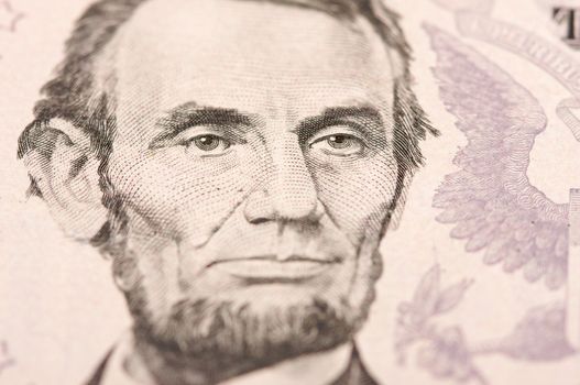 Abstract Macro of U.S. Five Dollar Bill's Abraham Lincoln face with Narrow Depth of Field.