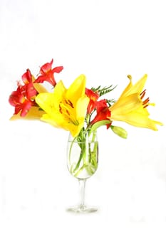 Bouquet of assorted lilies in a vase.