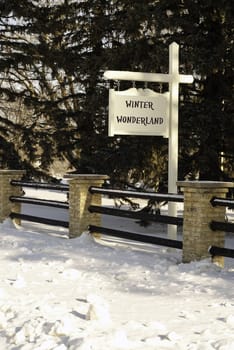 A fence and a sign saying" Winter Wonderland".  Not an actual place - no infringements.