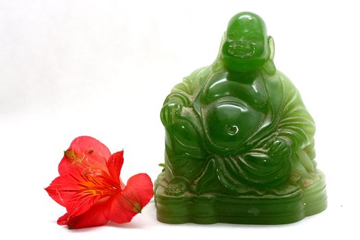 Green buddha with leaves and flowers