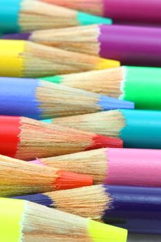 Pencil crayons, laying horizontal rainbow of colors