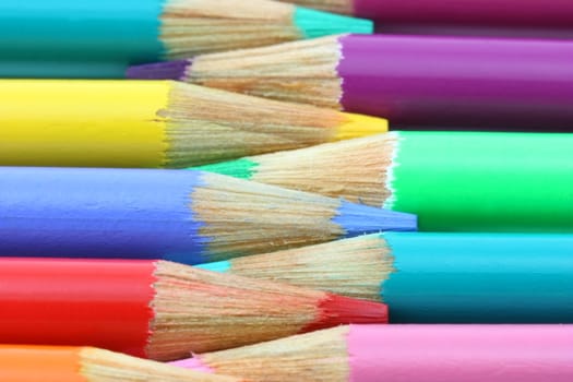 Colorful pencil crayons alternating horizontal