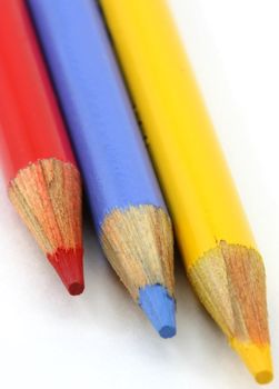 Pencil crayons, red, blue yellow primary colors portrait