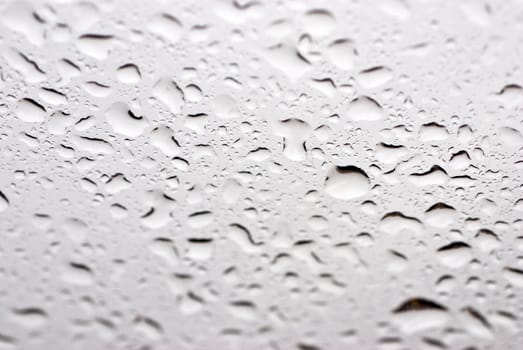 Drops of a rain on glass, liquid